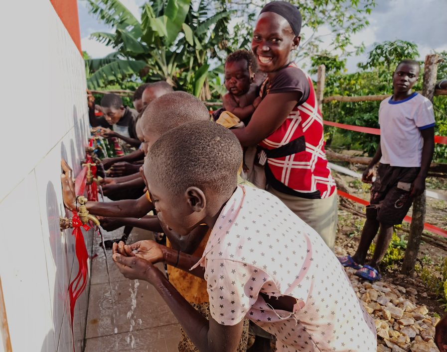 Children drinking clean water at a school tap